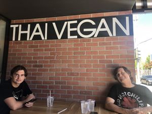 The fam seated outdoors   at Thai Vegan in Santa Monica
