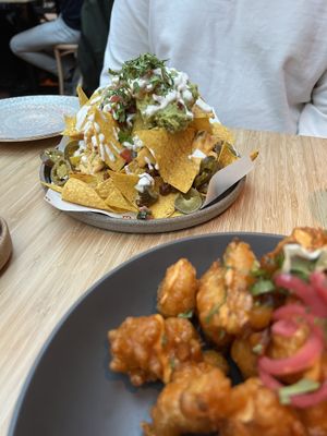 Nachos 10/10, and cauliflower wings 6/10  at Madre in Amsterdam