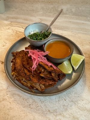 ‍‍BIRRIA QUESATACOS 
‍Corn tortillas filled with slow braised re-defined (3D printed) ‘pork’ in a smoky and savoury broth, served with dipping broth  at Madre in Amsterdam