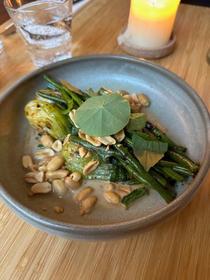 CHINTEXTLE GREEN BEANS
‍Green beans in a vibrant ancho-tahini ponzu, balanced with earthy greens and roasted peanuts at Madre in Amsterdam