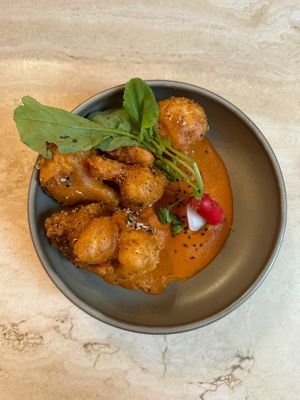 CHIPOTLE MOLE CAULIFLOWER WINGS
‍Cauliflower wings with a rich chipotle mole perfectly spiced made of white chocolate, tomatoes, almonds and chipotle  at Madre in Amsterdam