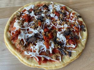 Vegan Sausage sundry tomatos  at Passione Emporio on 5th in Berkeley