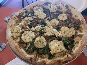 Build your own large pizza with cashew ricotta 😋 at Pi Vegan Pizzeria in Seattle