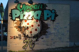 Pizza graffiti/art on the side of the Pizza Pi building. Photo taken March 2014. at Pi Vegan Pizzeria in Seattle
