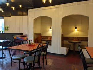 Inside seating booths at Pi Vegan Pizzeria in Seattle