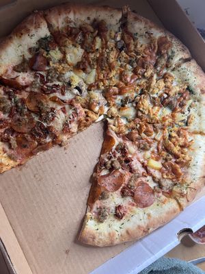 Half pad Thai pizza, half pepperoni, sausage, and sun dried tomatoes- with a stuffed crust.   at Pi Vegan Pizzeria in Seattle
