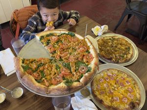 Butter chikin, Thai chikin and mac and cheese pizzas  at Pi Vegan Pizzeria in Seattle