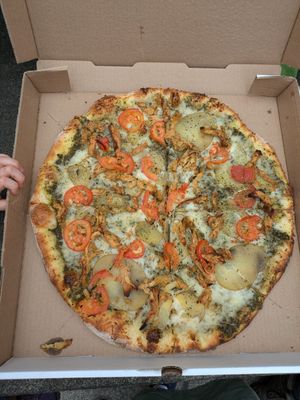 Pesto chicken pizza at Pi Vegan Pizzeria in Seattle