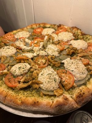 Pesto Pi: Pesto base, fresh tomatoes, potatoes, and seasoned chick'n, modified to use cashew ricotta instead of the mozzarella. Delicious!  at Pi Vegan Pizzeria in Seattle