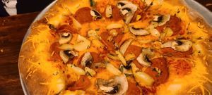 Stuffed crust pepperoni mushrooms garlic at Pi Vegan Pizzeria in Seattle