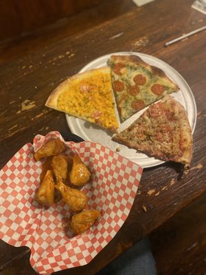Wings and pizzaa  at Pi Vegan Pizzeria in Seattle