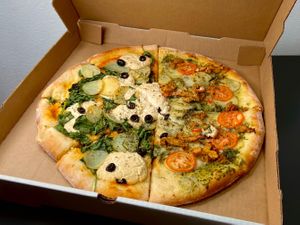 large sunny day + pesto pi (takeout) at Pi Vegan Pizzeria in Seattle