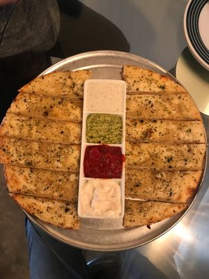 Cheesey bread and sauce sampler... So good!  at Pi Vegan Pizzeria in Seattle