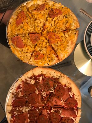 Mac and cheese pizza & meat lovers pizza! at Pi Vegan Pizzeria in Seattle