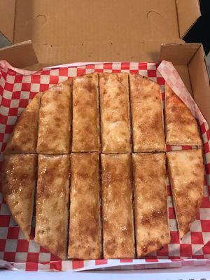 Cinnamon breadsticks for dessert.. These are a must!  at Pi Vegan Pizzeria in Seattle