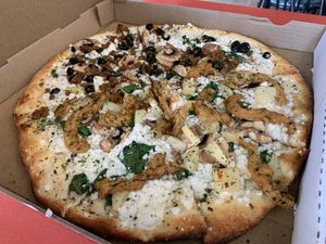 1/2 Thai chicken 1/2 white sauce fav.  at Pi Vegan Pizzeria in Seattle