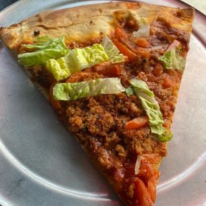 Pizza by the slice at Pi Vegan Pizzeria in Seattle