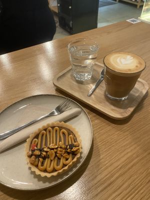 Flat white with oat milk and cake  #Veganuary at Share Sweet and Espresso Bar in Prague