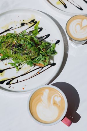 Avocado toast and oat latte   at Share Sweet and Espresso Bar in Prague