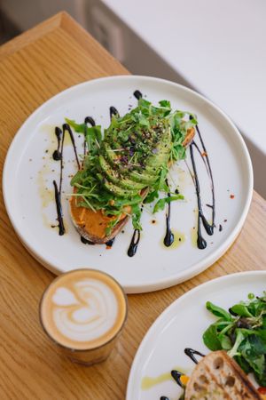 Avocado toast and oat flat white   at Share Sweet and Espresso Bar in Prague