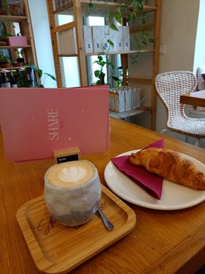 Cappuccino + croissant at Share Sweet and Espresso Bar in Prague