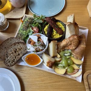 Share breakfast for 2 scrambled tofu, sausage, avocado, salad, chickpea spread with sun-dried tomatoes,
"goat" cheese, lemon bread, marmalade, butter, fruit, croissant, toast  at Share Sweet and Espresso Bar in Prague