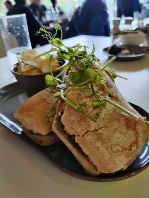 Toasted ciabatta with Cajun sweet potato, vegan feta, peppers. at Ochiltree's Cafe in Melrose