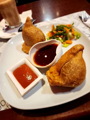 Samosas. I asked for a salsa picante. The red one on the left was spicy. at Vegan Mount in Barcelona