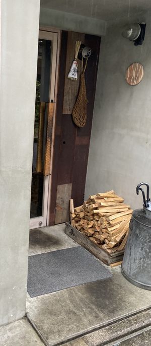 Entrance with firewood « Ki »   at Ki: Restaurant Shimizu Gojo - 汽 [ki:] レストラン 清水五条 in Kyoto