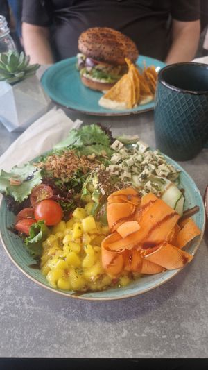 Poke bowl and burger in distance! at Brunch Club in Funchal