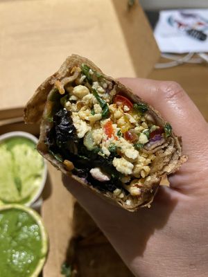 Old Delhi bhurji wrap close up (green chutney a too spicy for me but many others will enjoy)  at Greenr Cafe in New Delhi