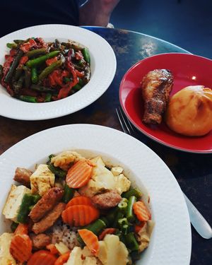 Yellow curry, sesame bean, soy drumstick, and BBQ bun. at HeartFood in Hobart