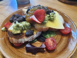 Vegan cheese toast - the mango thing was weird, mushrums and cheese were yummy. at Zenith Brunch & Cocktails in Barcelona