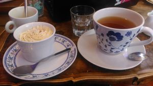 Carrot cake on th left, organic green tea on the right, citrus infused water in the middle (free of charge btw) at C is for Cookie in Reykjavik