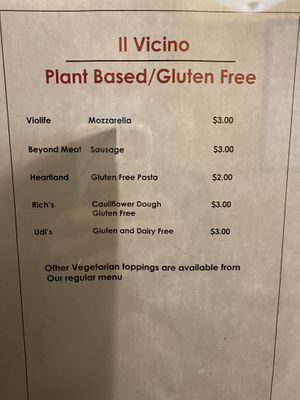 Paper posted of specific brands used on vegan and gluten-free pizzas  at IL Vicino in Santa Fe