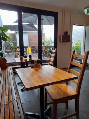 Indoors and outdoor deck at Stones Throw Cafe in Stones Corner