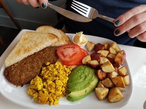 The Classic - sourdough toast, Impossible sausage patties, tofu scramble, sliced avocado & tomato, house potatoes at The LaFayette Place in Milwaukee