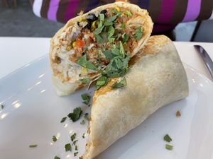 CHORIZO BURRITO 
Housemade chorizo, hashbrown patties, beans, corn, chipotle sauce, pico de gallo, diced peppers & shredded Violife cheese in a flour tortilla! at The LaFayette Place in Milwaukee