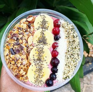Our 'Amagara' berry smoothie bowl with home made granola, banana, chia seeds, berries, coconut flakes and hemp seeds at Ijuru Plant Bliss  in Kampala
