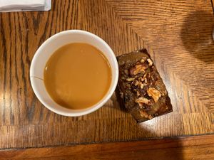 A coffee with oat milk and a mini cake. *Not seen was a vegan muffuletta and Kobocha squash hummus meal that I devoured!  at Malvern Buttery in Malvern