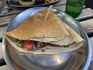 Savory crepe with Next plant-based bacon, mushrooms, caramelized onions, sauce, lettuce, and tomatoes   at 269 Fast Vegan Food in Crete
