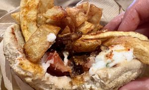 “Pork” gyro, classic size (with one bite taken )  at 269 Fast Vegan Food in Crete