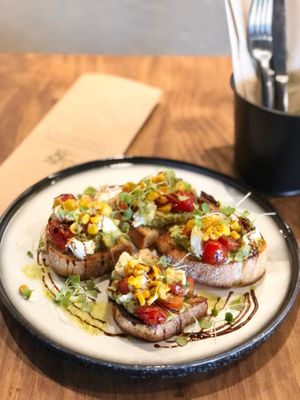 Bruschetta
vegetarian, vegan possible

Marinated heirloom tomatoes, bocconcini, pesto oil, charred corn, basil, smashed avocado, balsamic glaze, sourdough crostini. at La Cantina in Tauranga