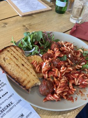 Vegan meatball pasta with garlic bread  at VK Plant Based Diner in Waterlooville
