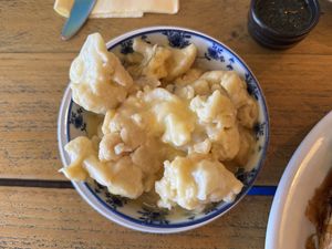 Cauliflower cheese on the sidee  at VK Plant Based Diner in Waterlooville
