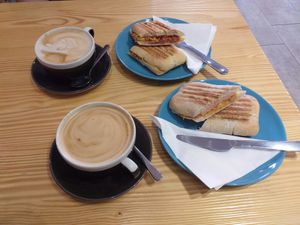 Oat milk latte and toasties at Divine Coffee House in Nottingham