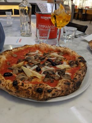 Pizza capriciosa with vegan cheese at Rossopomodoro in Copenhagen
