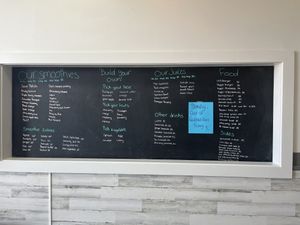 Wall menu  at The Squeeze Juice Bar and Vegan Eatery in Vicksburg