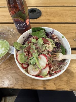 Mother Earth Bowl, Spinach coconut dressing and detox water  at Natoo in Frankfurt