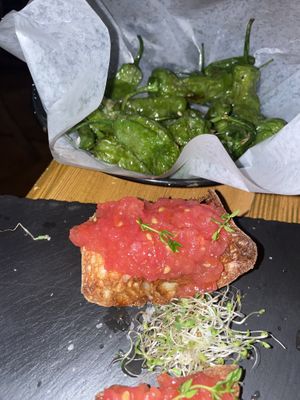 Fried baby green peppers and Toasted homemade artisanal bread with tomatoes and garlic at Eatapas in Fort Lauderdale